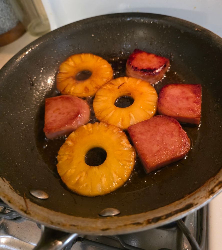 Cooking spam and pineapple. All brushed with Teriyaki 