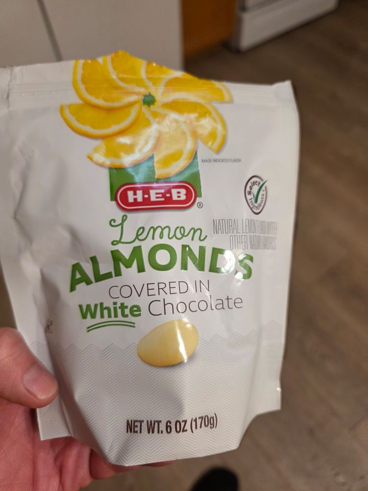 HEB store brand lemon almonds covered in white chocolate...... yummy 😋 