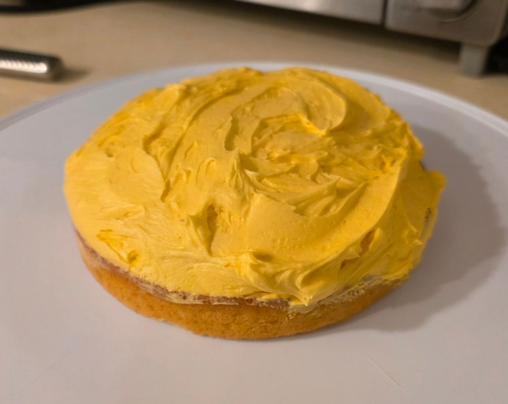 A small finished, frosted cake