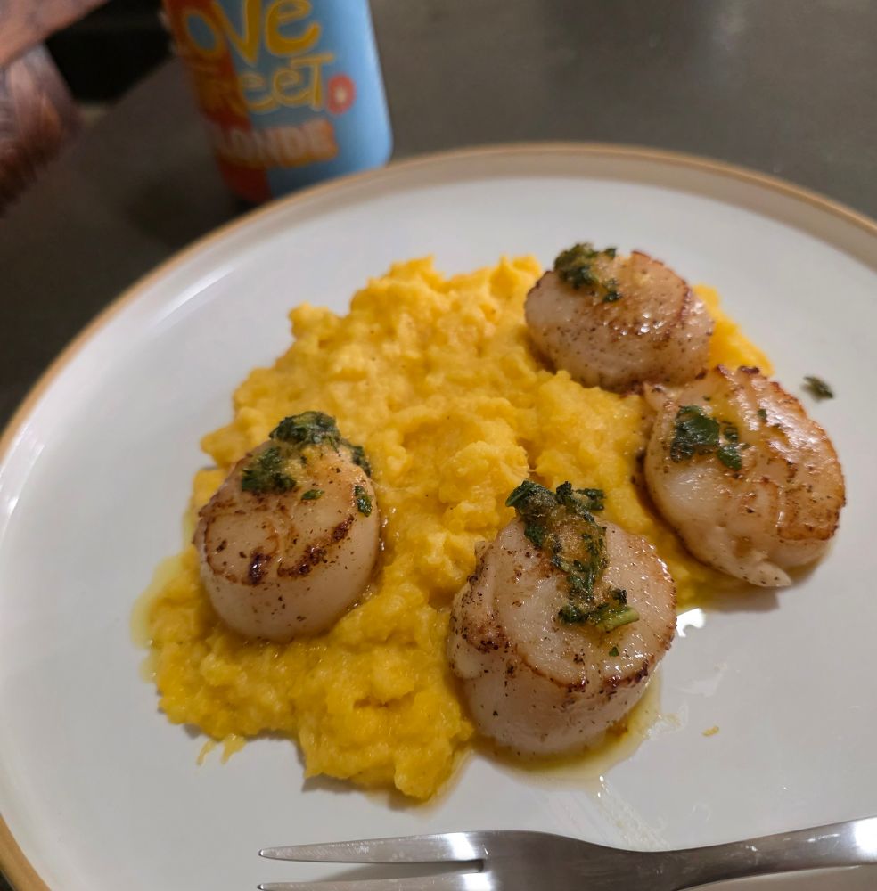 Four scallops with lemon sage butter sauce on a bed of mashed buttered squash... and a beer... gout be damned 