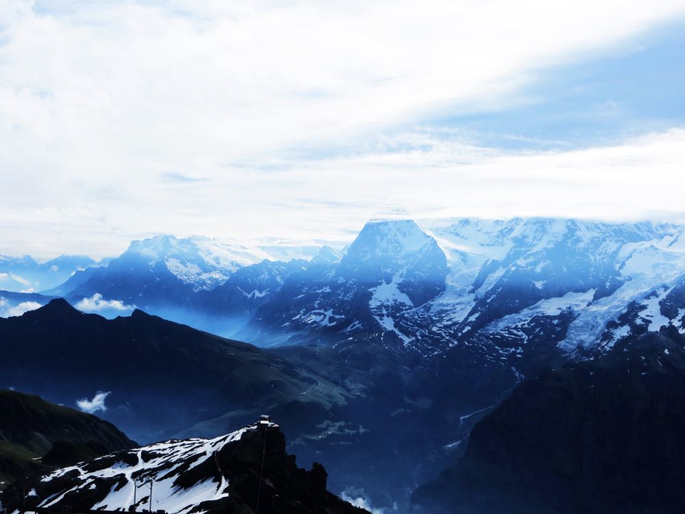 View from the Schilthorn Mountain down to the Lauterbrunnen valley and the Jungfraujoch mountain in the Jungfrau region, Switzerland by Sonja Holverson