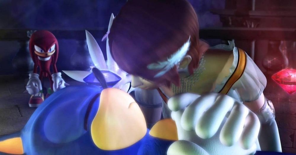 Princesa Elise beijando o sonic morto, enquanto Knucles no fundo olha desacreditado, nessa cena merda q eles está presenciando