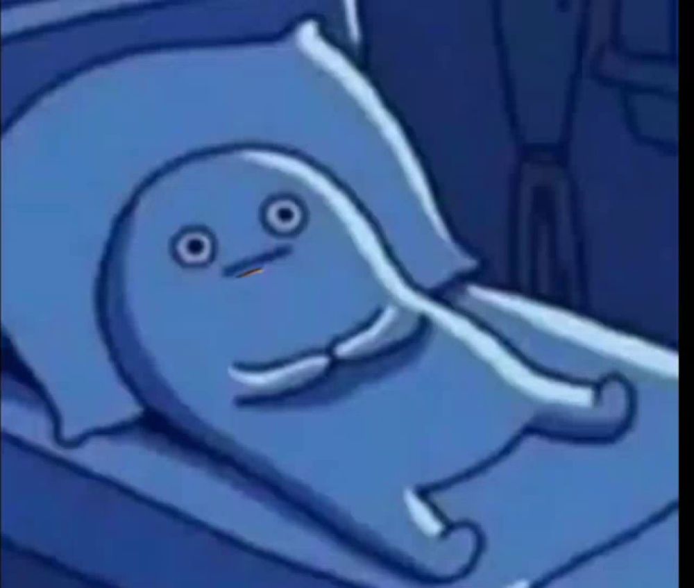 a cartoon character is laying in a bed with a pillow and a blue blanket .