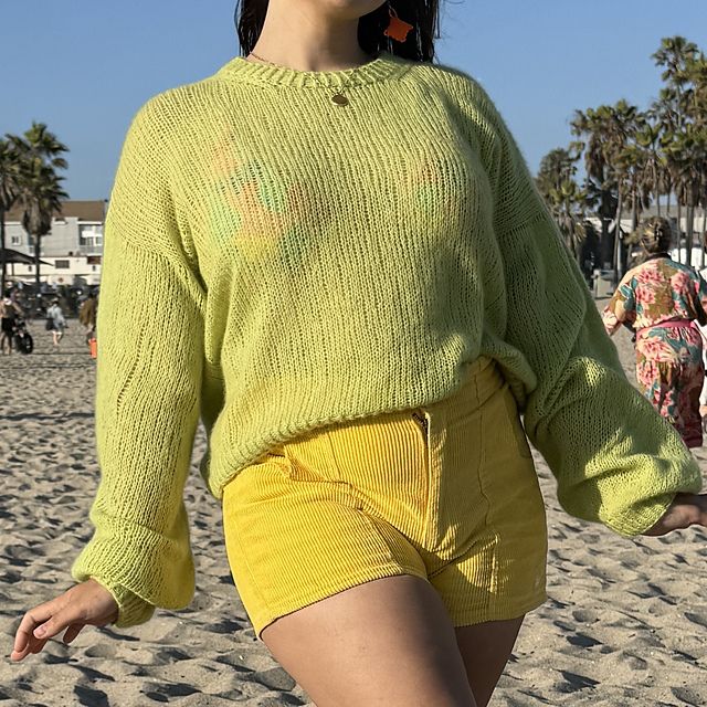 The front of the sweater, now styled with yellow corduroy shorts.