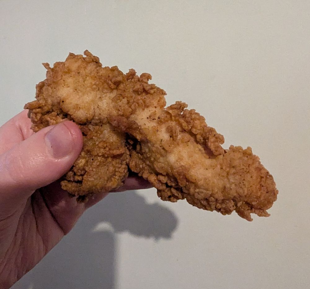 Photo of a piece of fried chicken that is sexually suggestive in shape