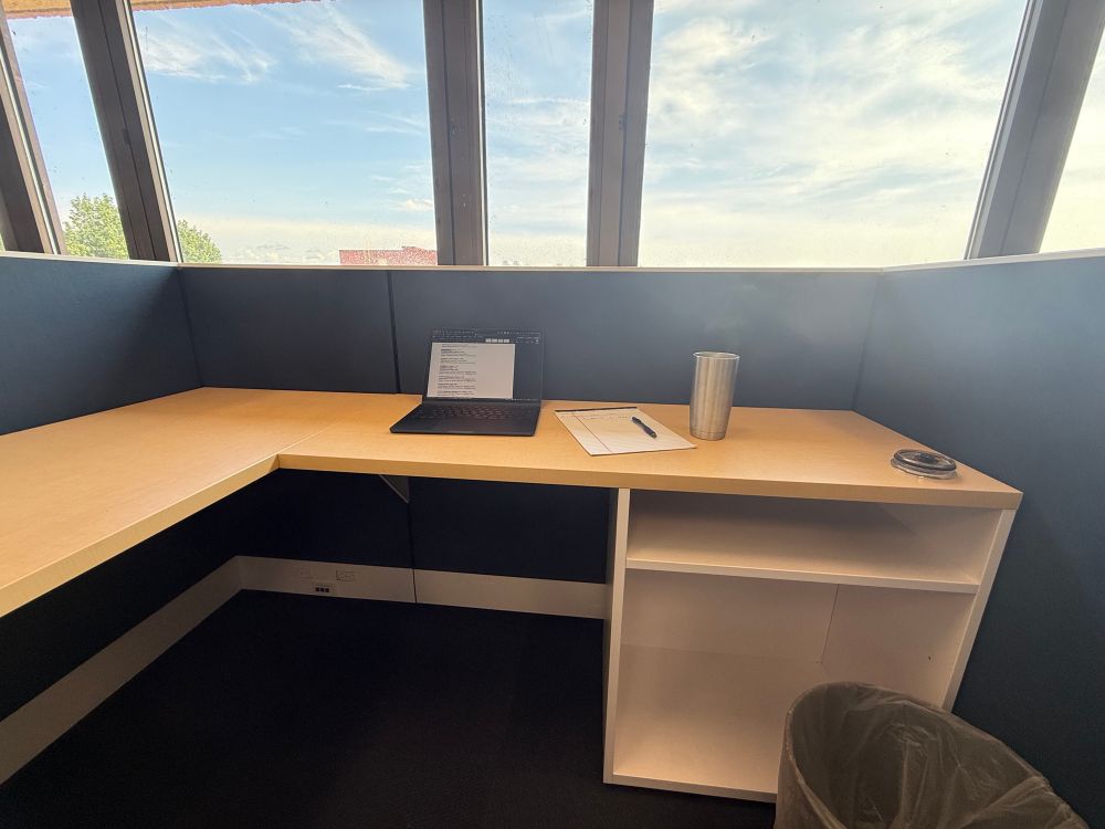 A small cubicle with a laptop 
