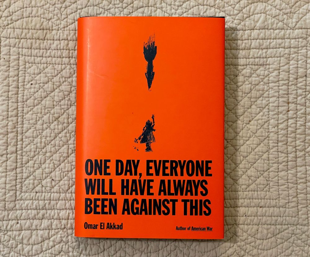 Cover of ONE DAY, EVERYONE WILL HAVE ALWAYS BEEN AGAINST THIS by Omar El Akkad. Black text on red book cover. Stylized drawing of a silhouetted child standing under a falling bomb.