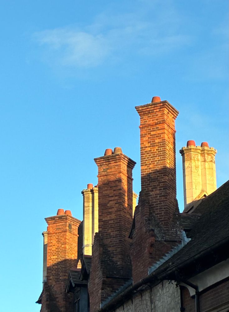 Chimney stacks against blue sky in Cambridge 