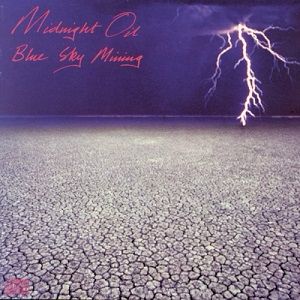 The cover of Midnight Oil’s “Blue Sky Mining” album. There is a parched landscape and lightning.