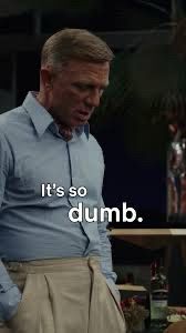 Detective Benoit Blanc in a blue shirt saying ‘It’s so dumb’