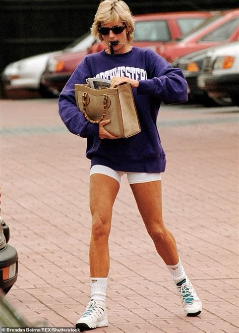 Princess Diana walking across a red brick sidewalk digging in a straw tote bag wearing white sneakers, white crew socks, white mid thigh bike shorts and a Royal blue sweatshirt and black sunglasses and is fucking iconic 