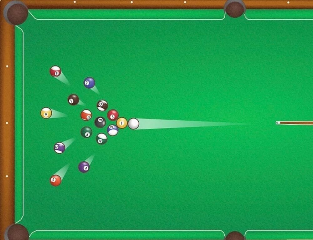 A white ball breaks the pack on a pool table.
Balls everywhere
