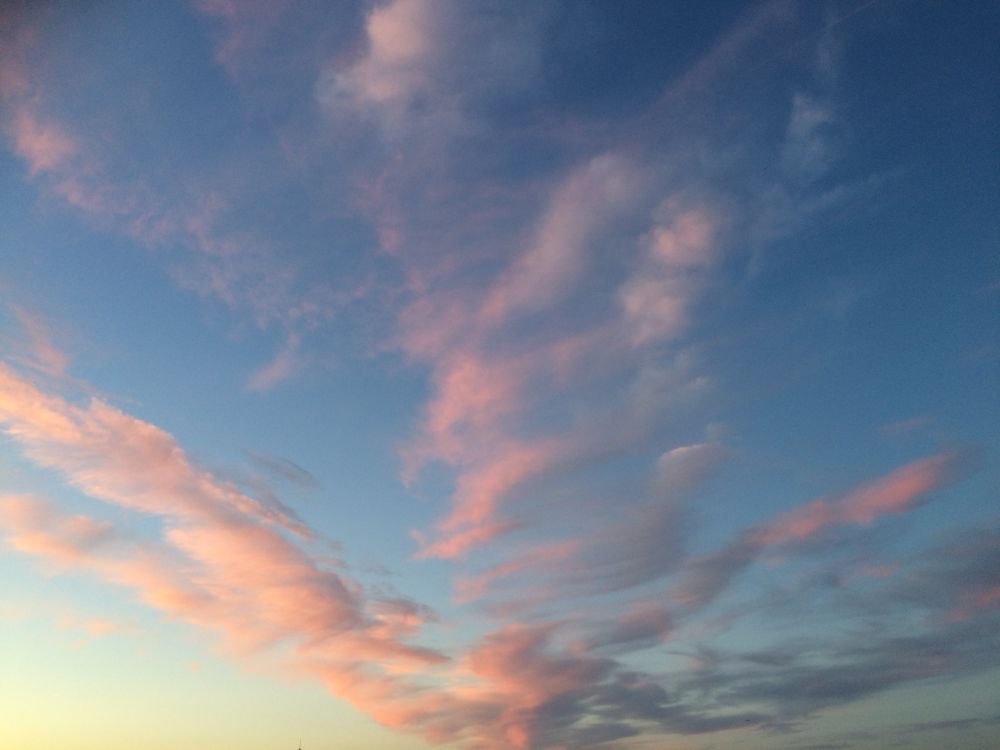 Evening sky with clouds turning pink at sunset 