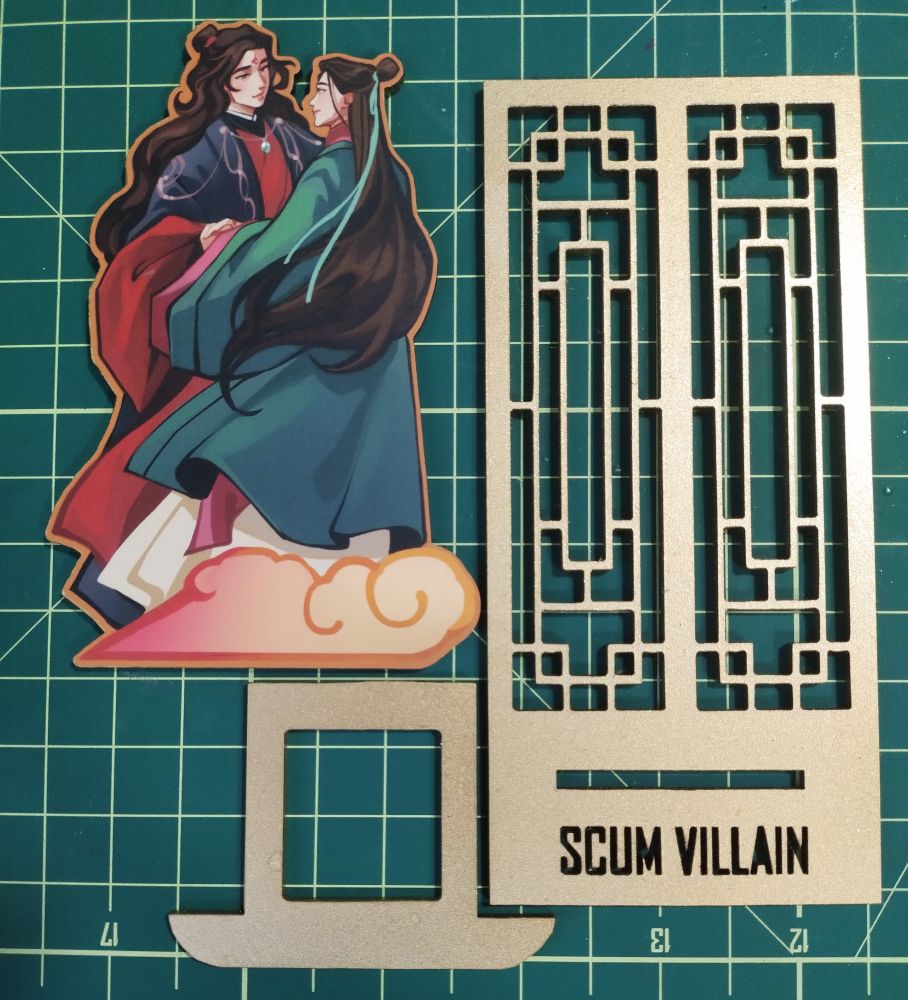 Pieces of a wooden standee, with a chineses windows back and bingqiu art to stand on It.