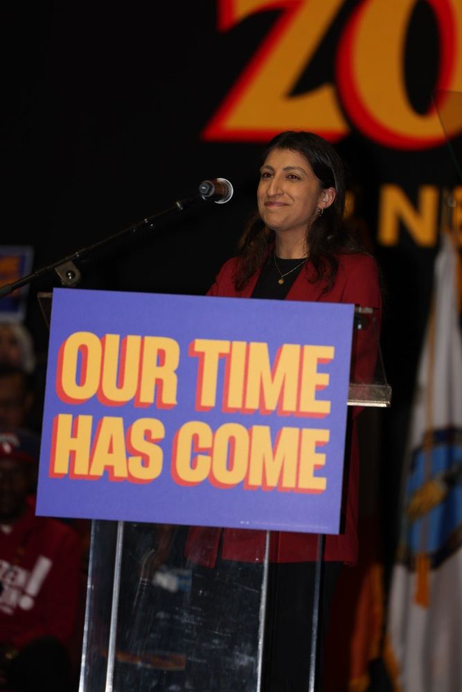 Lina Khan on stage at the podium