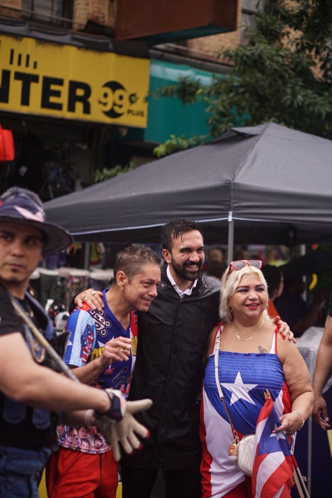 Zohran meeting voters at the 116th Street Festival.