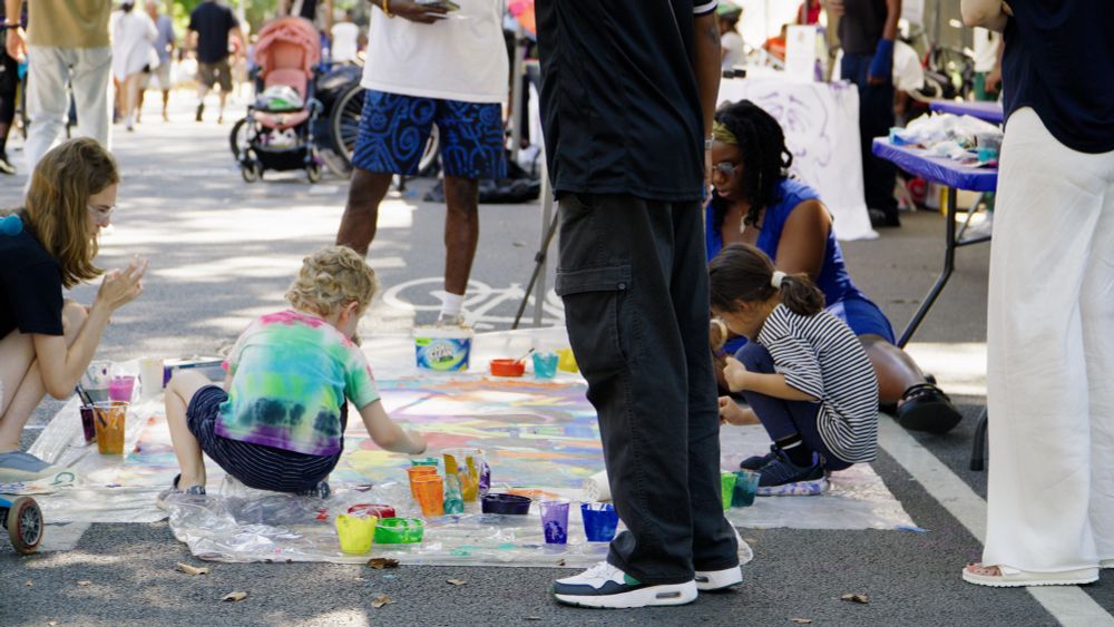 Children making art in the street. 