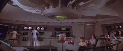 Star Trek: An image of the bridge of the Enterprise, as presented during "The Motion Picture". It is relentlessly... beige. Open-looking, though.