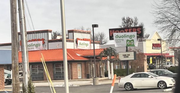 Duolingo banners over the Hooters Logo at a St. Louis Hooters