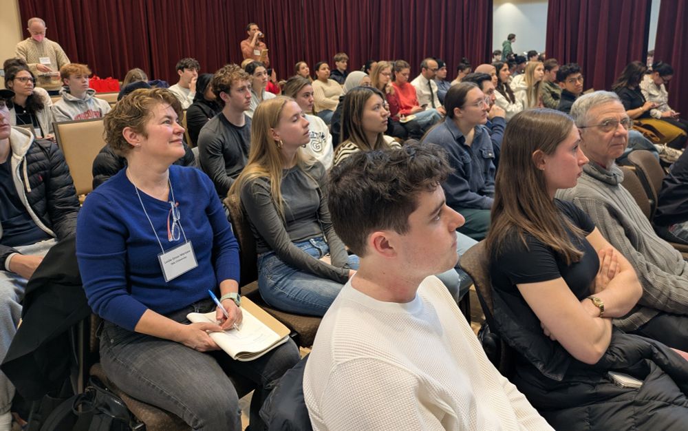 A view of the audience at the conference, very crowded.