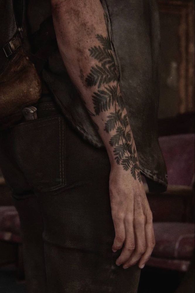 ellie from tlou covered in grime but its just her arm tattoo which is a fern or other plant of some kind