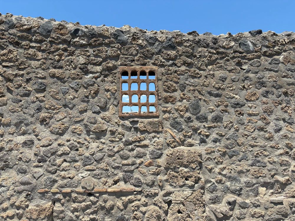 A lovely little screen in the wall of an insula, Pompeii