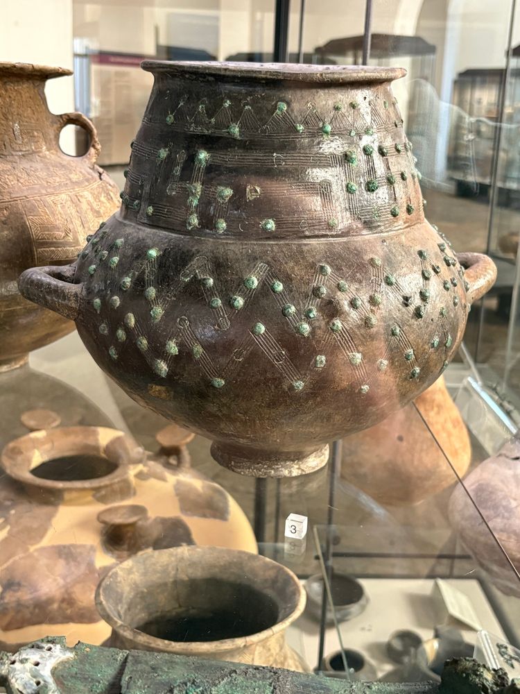 A fascinating clay vessel with etching meanders and inset bronze disks, Capua Museum