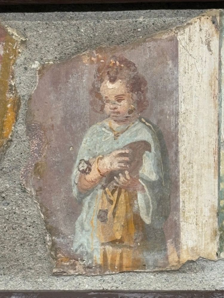 A fresco of a young girl holding a bird, Pompeii