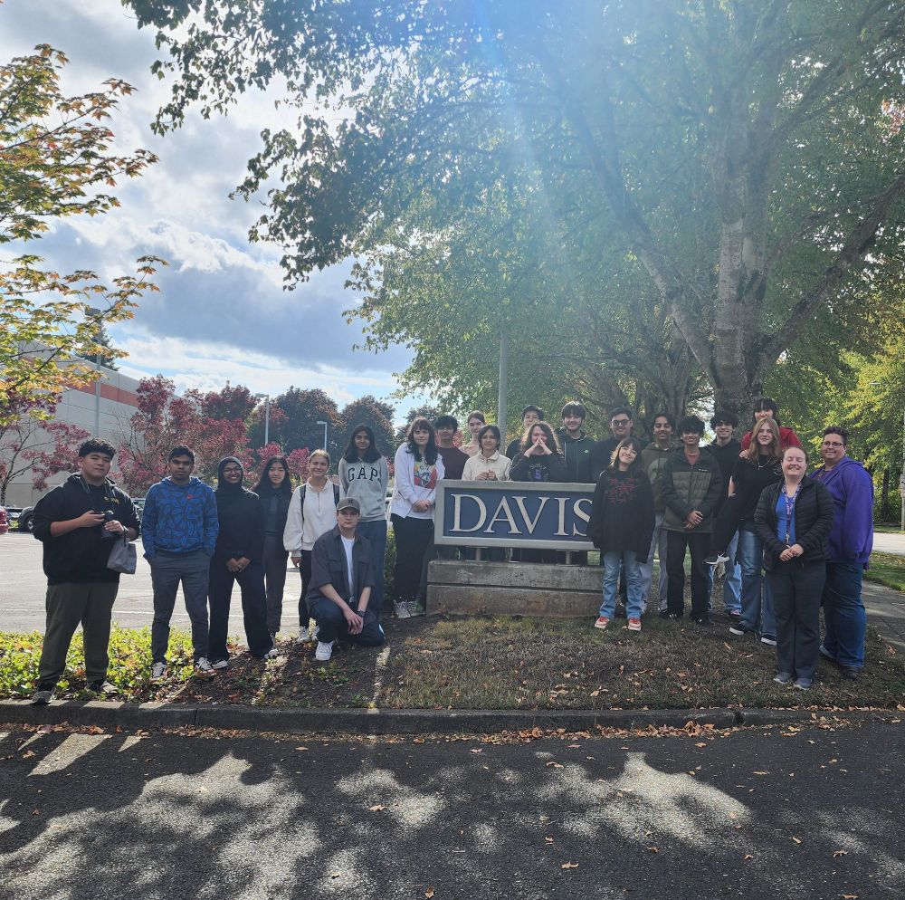 High school group around sign reading "Davis"