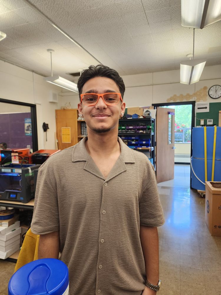 Student wearing 3d printed glasses frames