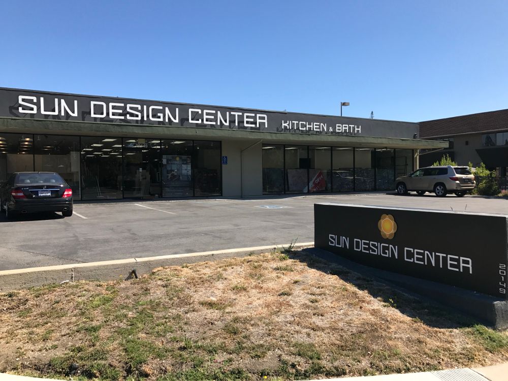 A pair of signs for “Sun Design Center” in Cupertino. The capital letter “N”s are rotated 180 in one sign when compared to the other.