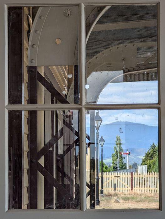 A view through window panes towards a home signal.