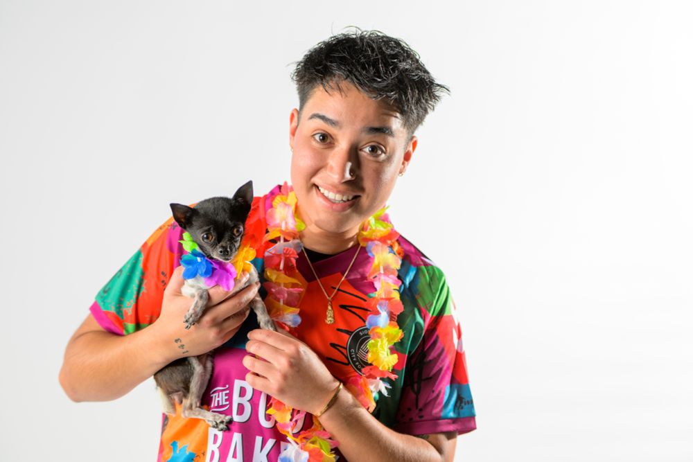 SFCFC player holding a small chihuahua 