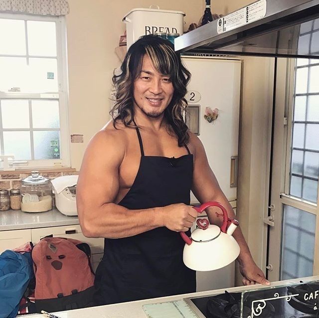 hiroshi tanahashi, the once in a century champion and ace of new japan pro wrestling, looking extremely milfy, just absolutely delicious. he's wearing an apron and no shirt and holding kettle with a heart-shaped handle and his tits look fucking bananas.