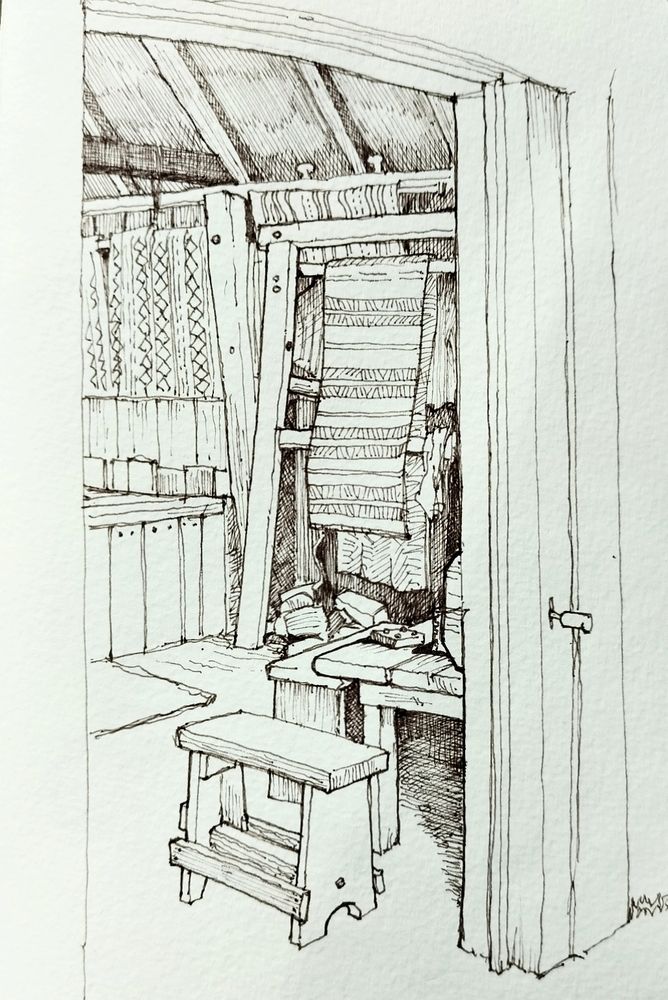 Pen sketch of a loom seen through an open doorway. 