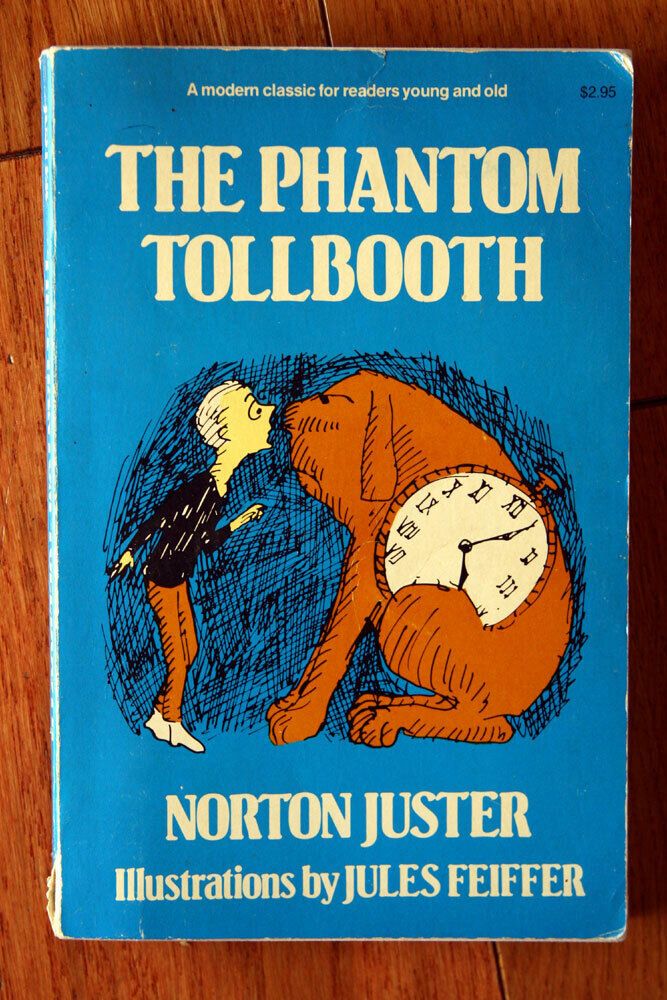 A young boy named Milo meets Tock, the watchdog (a large dog with a large clock in his midsection), on the cover of The Phantom Tollbooth paperback. 