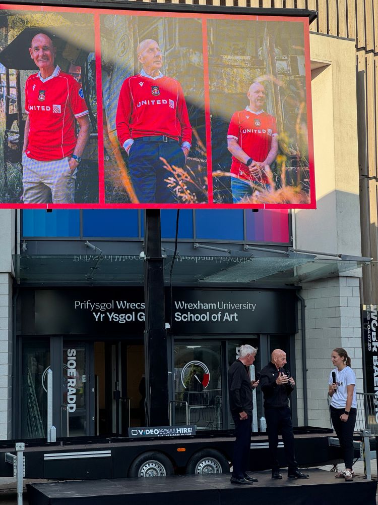 Dixie McNeil, Mikey Thomas and Mia Roberts outside the new club shop ahead of opening. 