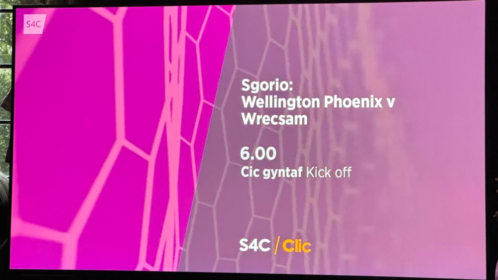 TV showing a waiting screen which reads: “Sgorio: Wellington Phoenix v Wrecsam, 6.00 Cic gyntaf/Kick off, S4C/Clic”