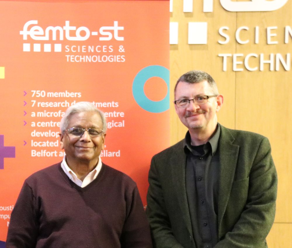 Govind Agrawal and John Dudley in front of FEMTO-ST banner