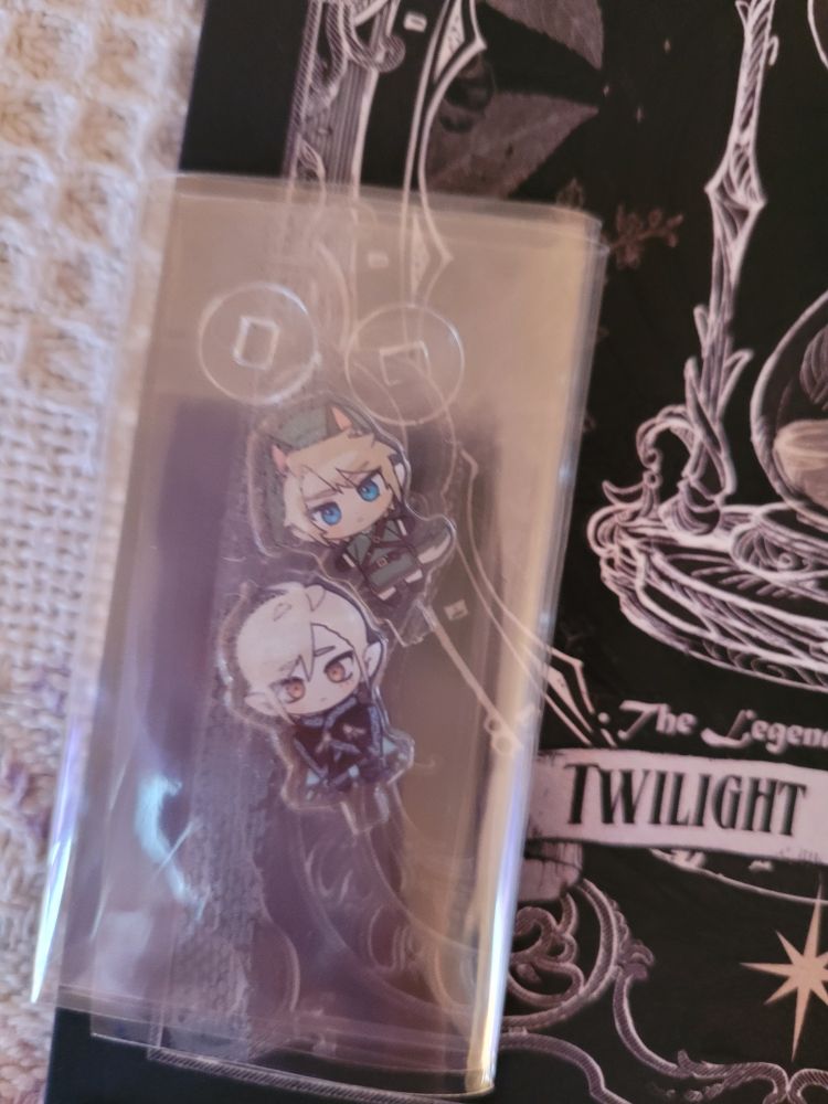 Petite standees of Twilight Princess Link and Isa's OC Timick.