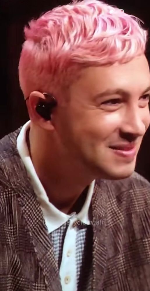 A screenshot from the Instagram reel in the link, which is an outtake from the SAI live stream, with Tyler Joseph, smiling