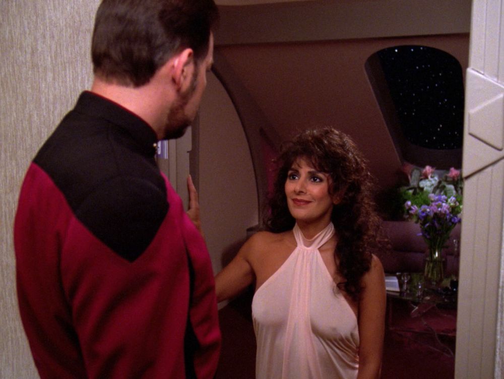Troi wearing a barely there nightgown