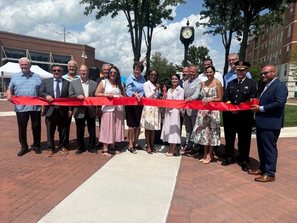 MWRD and Willow Springs officials pose for a ribbon cutting photo in the Town Center.