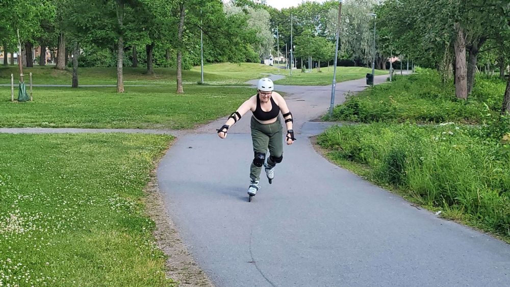 butch rollerskating in a park