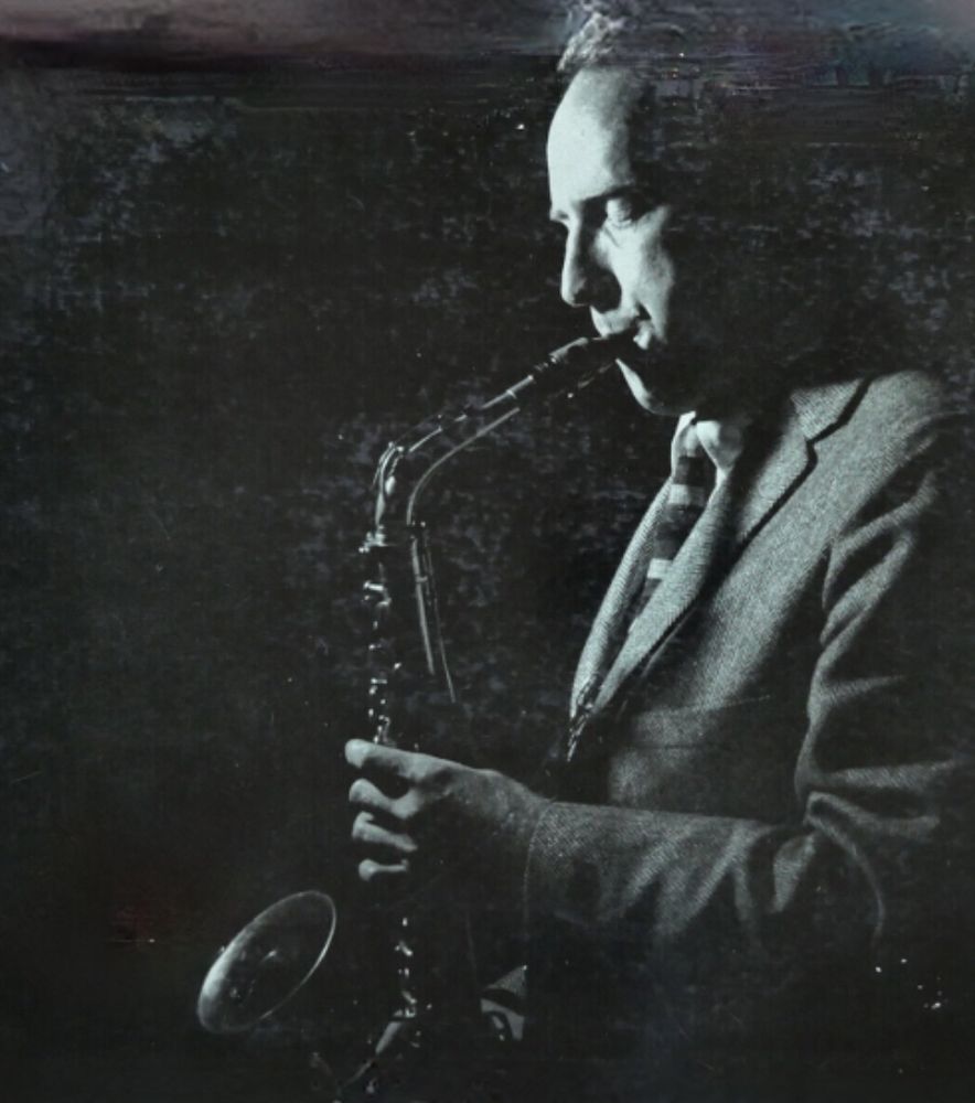 Saxophonist Hal McKusick playing his instrument 