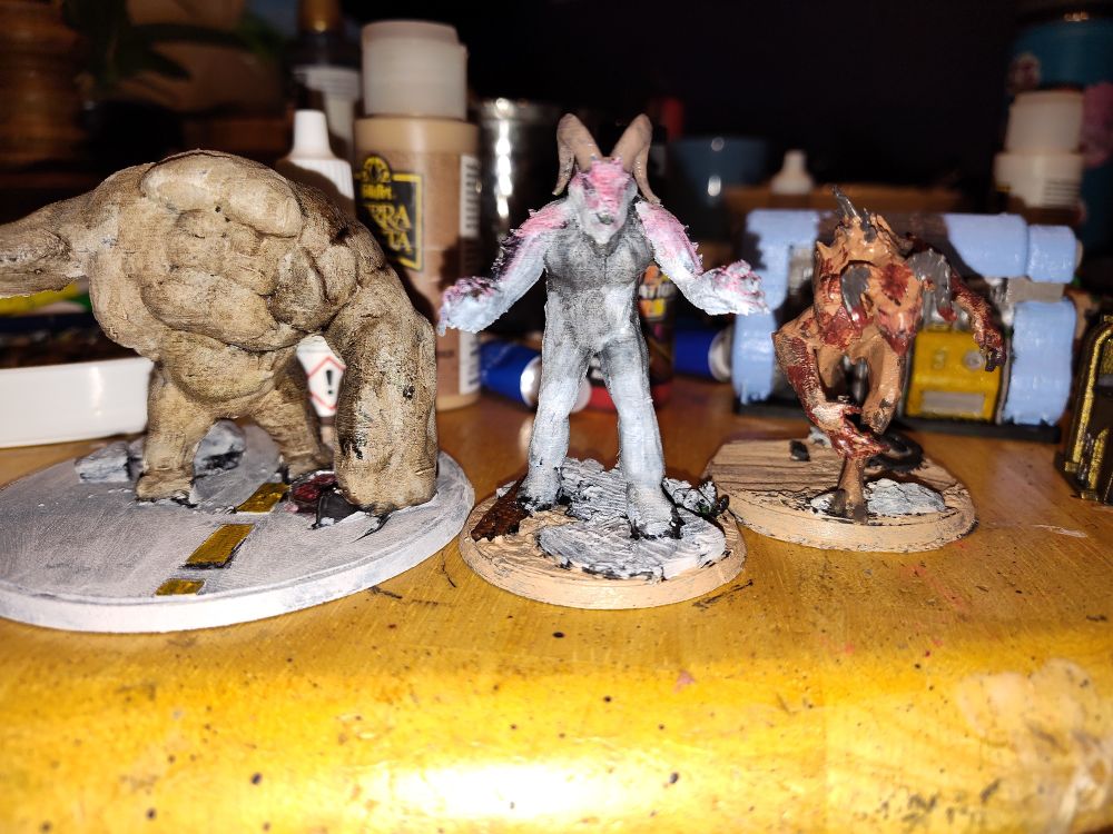 Three ttrpg miniatures for the Fallout RPG. A Grafton Monster, a Sheepsquatch and a Deathclaw. 
