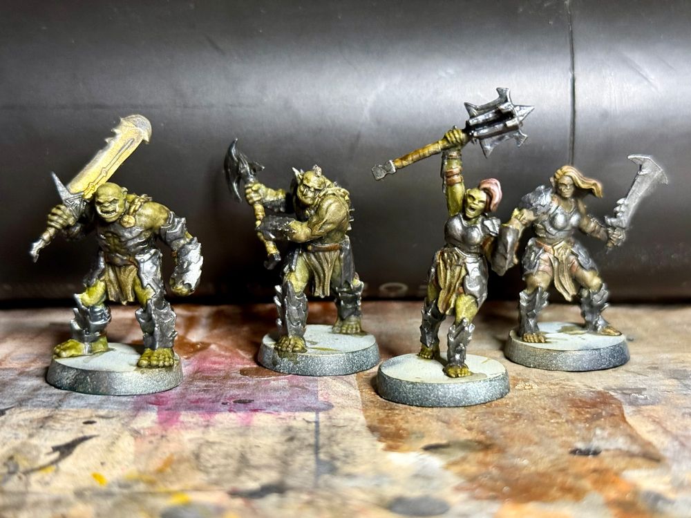 Painted minis from the HeroQuest board game – a selection of orcs with various weapons