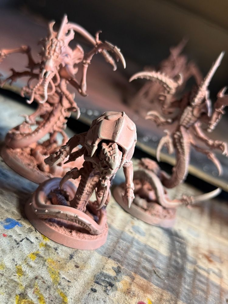 Two ravener and a neurolictor, undercoated with a pastel pink with lighter highligts