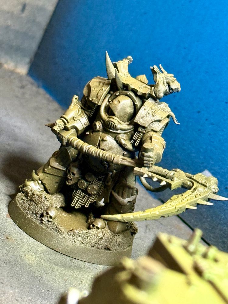 A terminator plague marine with a huge scythe