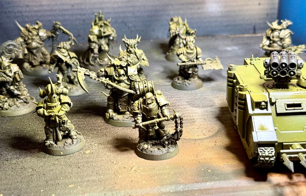 A combat patrol of plague marines, airbrushed in a basic green